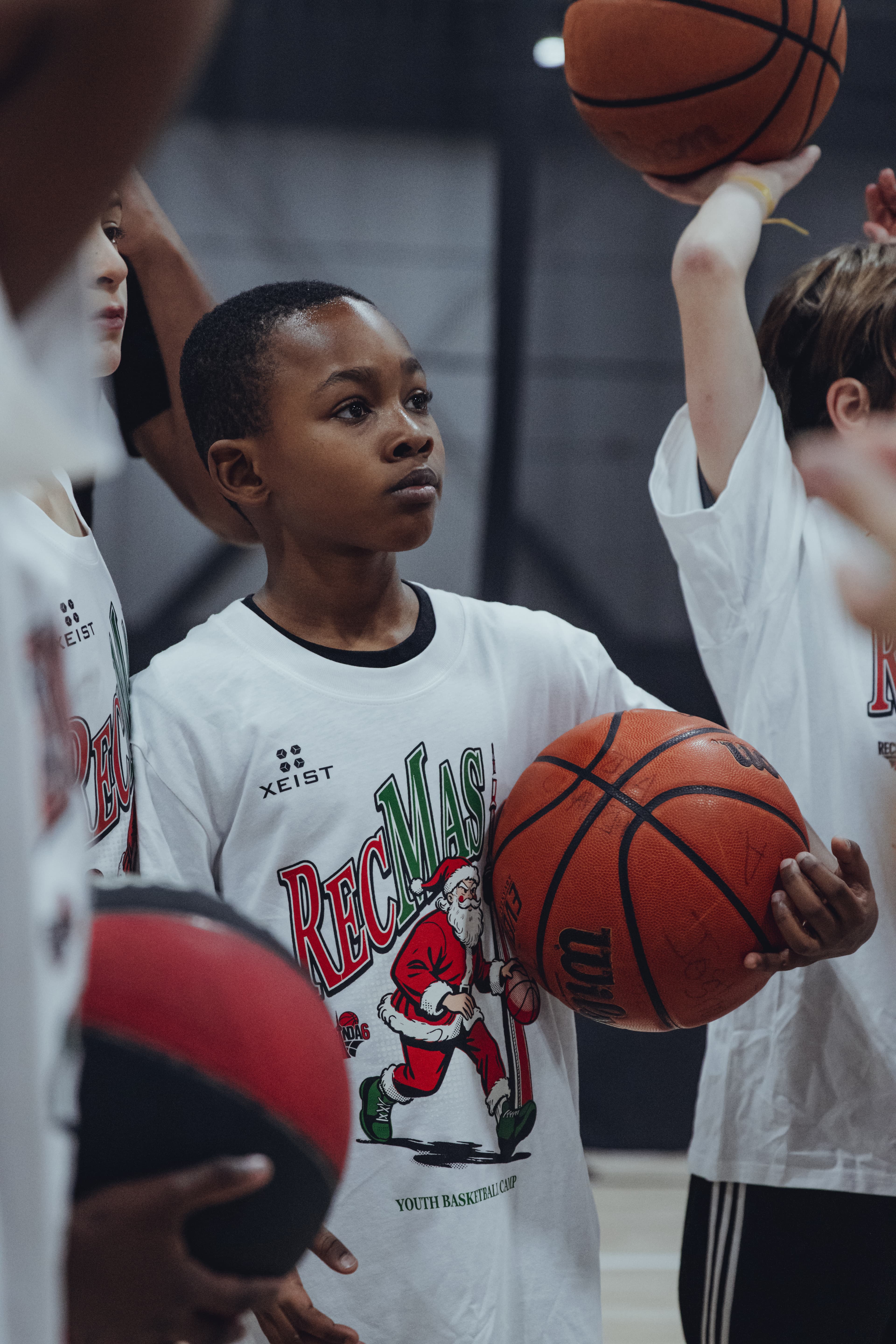 Young athletes participating in a RecInDa6ix basketball camp session